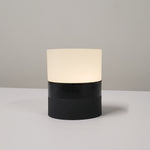 Shown Ola BLK2BLK, a portable lamp with matte black and glossy black base.