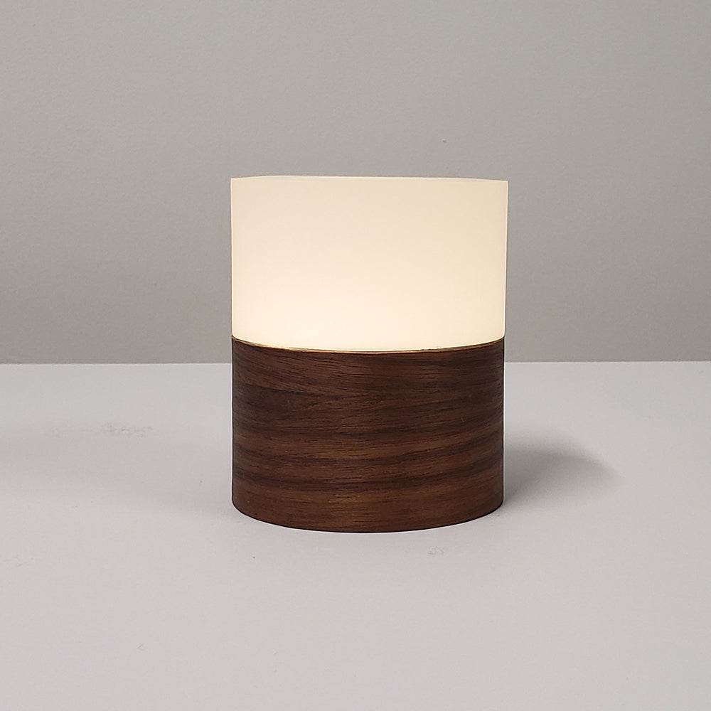 Ola portable lamp with real Walnut wood veneer base.